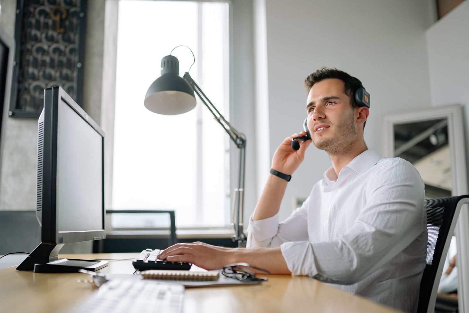 Customer support specialist at a workstation